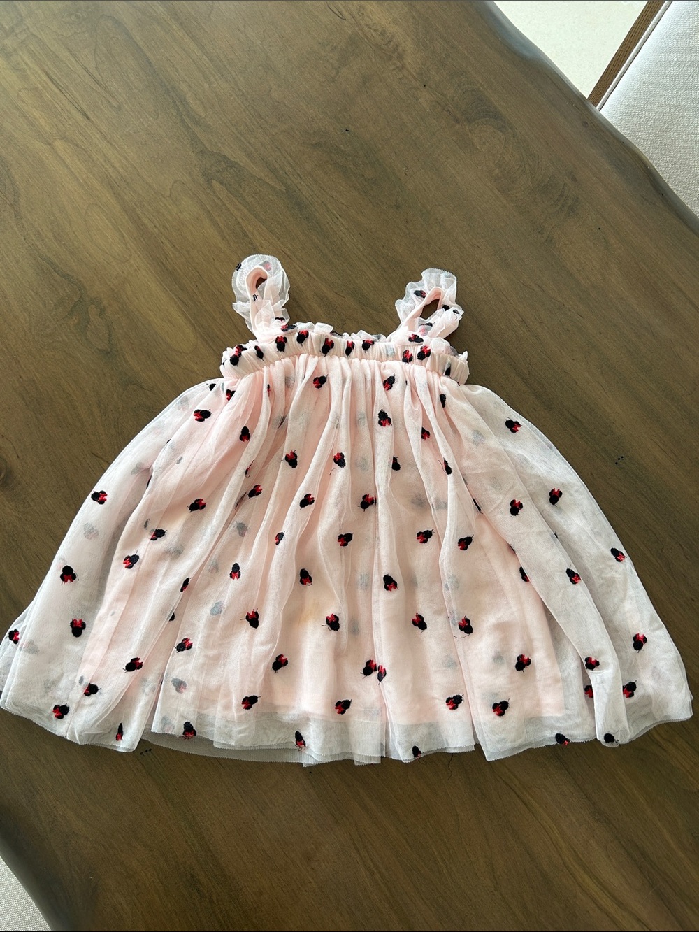 Kids Pink Sleeveless Ruffle Dress with Black Flower Embroidery